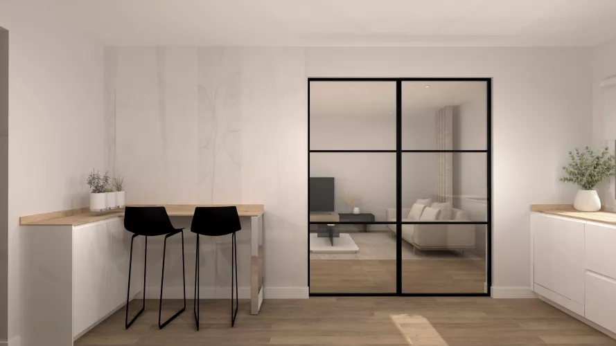 Cocina luminosa con barra integrada y cerramientos de hierro negro