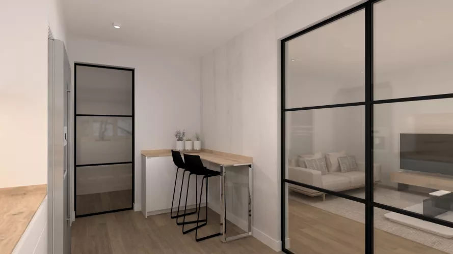 Cocina luminosa con barra integrada y cerramientos de hierro negro