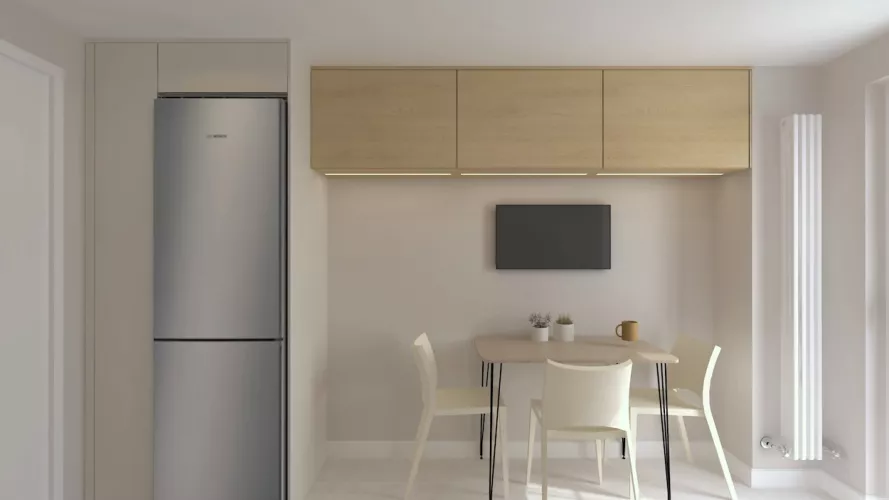 Zona comedor en cocina blanca con altos en madera