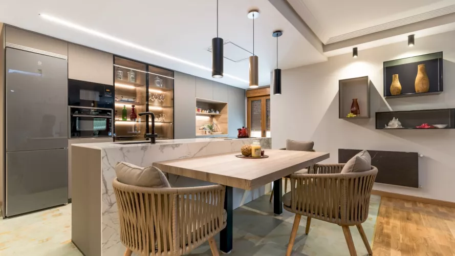 Cocina Santos gris con isla y mesa