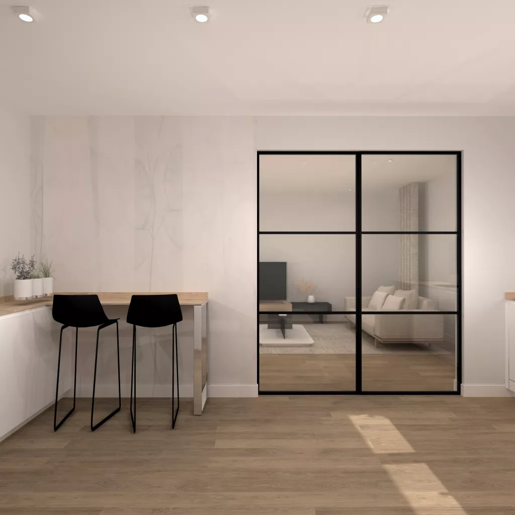 Cocina luminosa con barra integrada y cerramientos de hierro negro