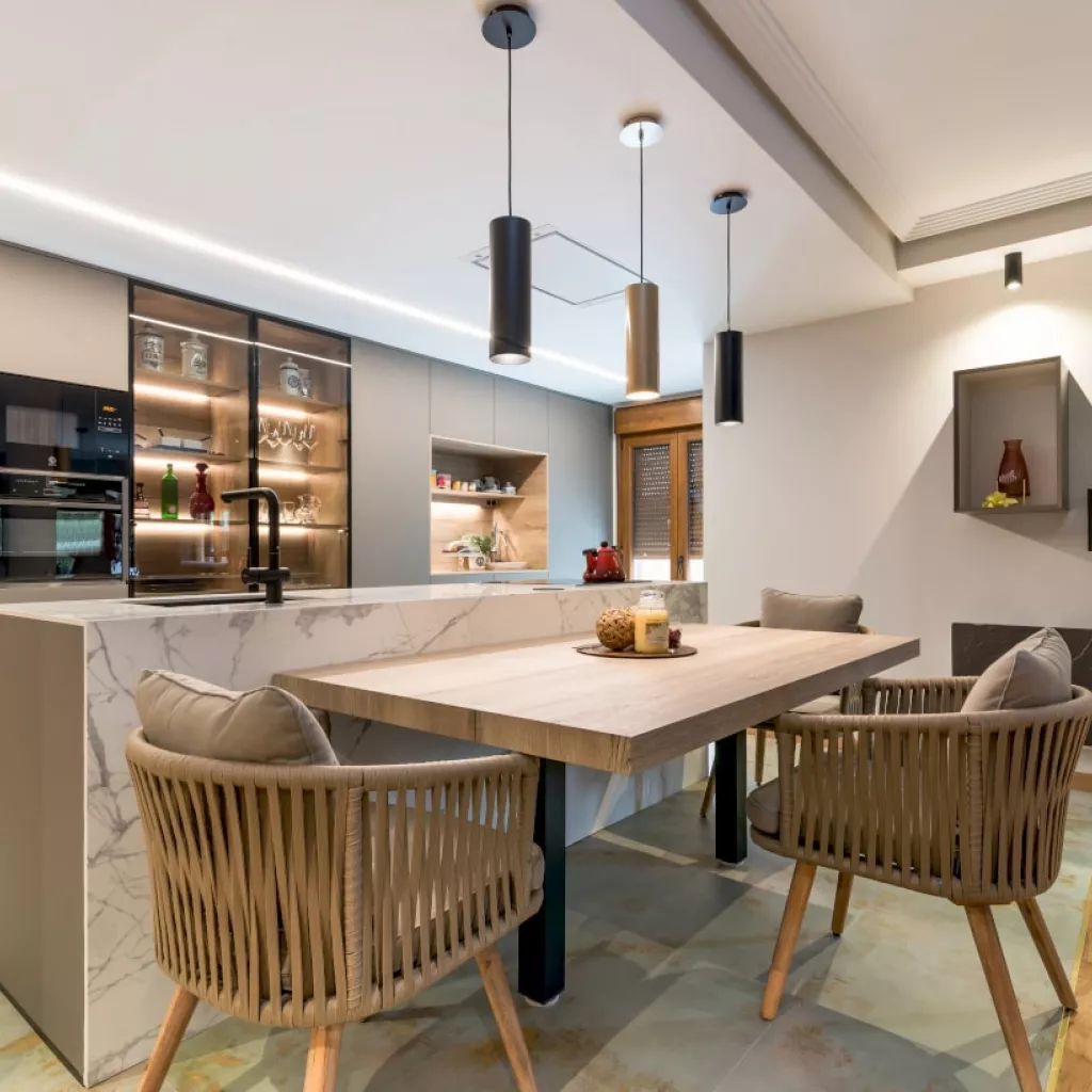 Cocina Santos gris con isla y mesa