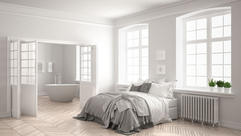 Dormitorio de estilo nórdico con bañera al fondo